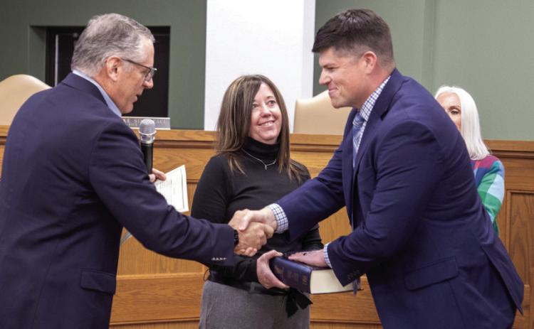 Durant city council member for Ward 2 Clint Morrison was sworn in Monday by Mayor Martin Tucker. Also shown is Morrison’s wife, Ashlee. Morrison won the Feb. 10 election.