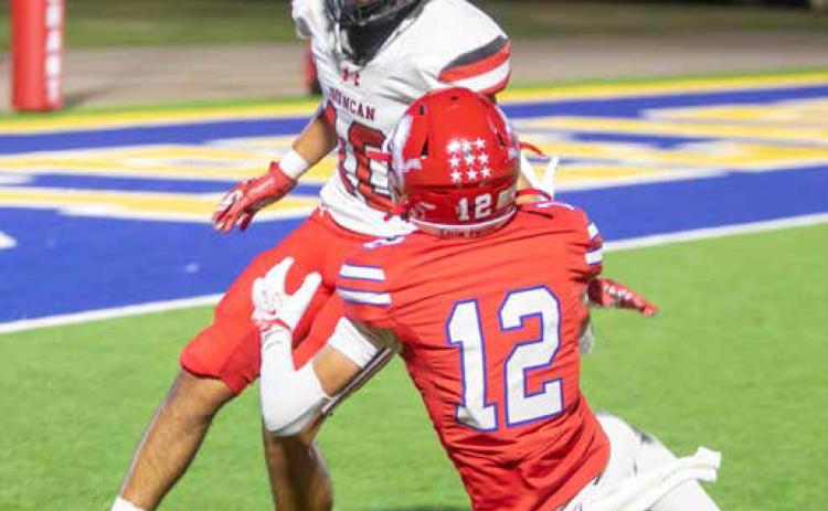 ABOVE: Durant Lion Jaxon Fouse misses a pass in the homecoming game with Duncan. The Lions won the game 40-10