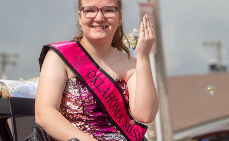 Maycee Webb, Oklahoma Miss Amazing Junior Teen Queen 2025, waves during the Kingston July 4th Parade.