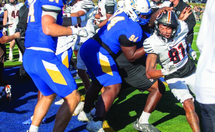 Southeastern Savage Storm football won the game with rival East Central 24-19 in the 108th meeting of the Great American Classic and fights broke out after the game. Among those shown are SE players Grayson Stewart and Joshua Govan and ECU player Xavier Gordon. Matt Swearengin | Durant Democrat