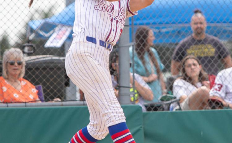 Lady Lion Raelynn Clark swings at the ball.