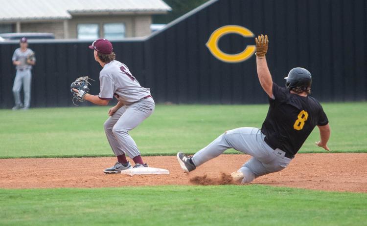 Matt Swearengin | Durant Democrat Calera Bulldog Jaron Varner slides into second base during last week’s game with Colbert.
