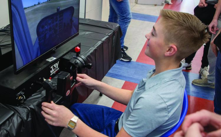 George Washington Elementary School held its Science, Technology, Engineering and Mathematics (STEM) night recently and a flight simulator was among activities. Matt Swearengin | Durant Democrat