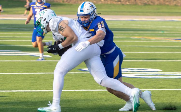 SE’s Trevin Hohenberger tackles a University of Arkansas-Monticello player. Matt Swearengin | Durant Democrat