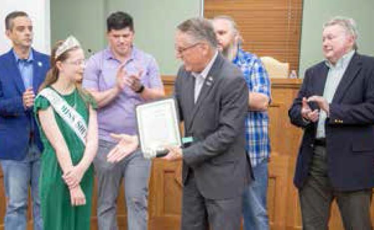Durant Mayor Martin Tucker presents Karleigh Miles with a proclamation designating June 29 as Scoliosis Awareness Day in the City of Durant. Also shown are Vice Mayor Mike Simulescu and council members Clint Morrison, Humphrey Miller and Danny Sherrer. Matt Swearengin | Durant Democrat
