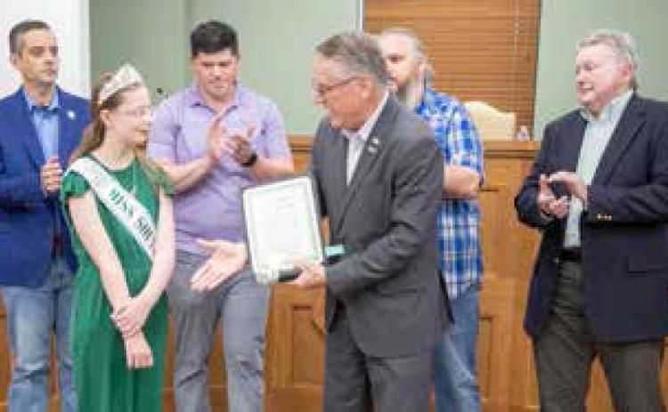 Durant Mayor Martin Tucker presents Karleigh Miles with a proclamation designating June 29 as Scoliosis Awareness Day in the City of Durant. Also shown are Vice Mayor Mike Simulescu and council members Clint Morrison, Humphrey Miller and Danny Sherrer. Matt Swearengin | Durant Democrat