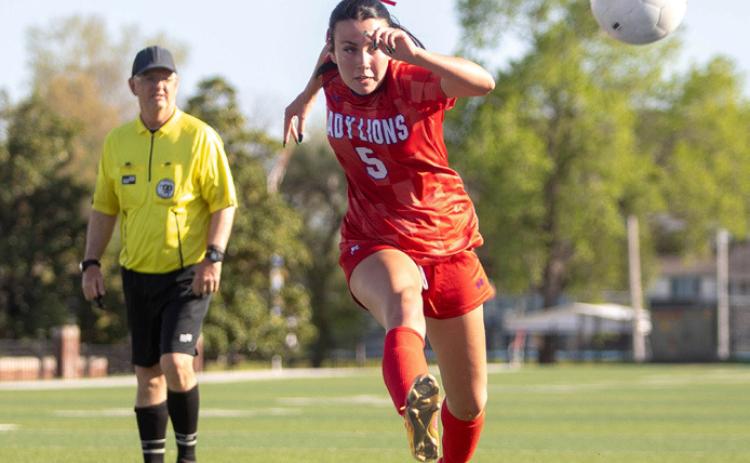 Lady Lion Kamryn White kicks the ball in the game with Tulsa Hale. Matt Swearengin | Durant Democrat