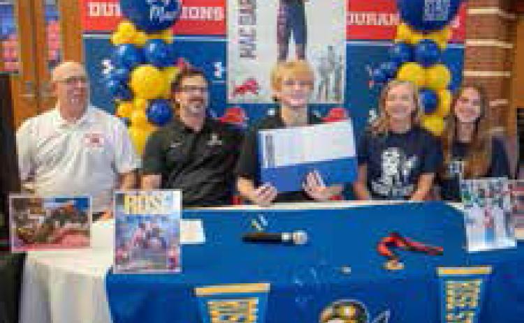 Durant High School senior Mac Barbush signed a scholarship offer for wrestling at Rose State College. He is shown with DHS head coach Jim Taylor, his father John Barbush, who is a wrestling assistant coach, mother Amy Pierce Barbush and sister Ella Barbush. Matt Swearengin | Durant Democrat