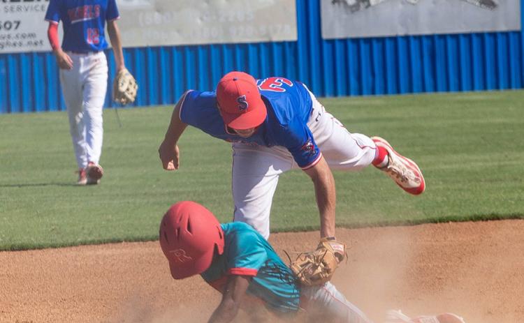 Silo Rebel Brycen Salsbury tags a Riverside player during a recent game. Matt Swearengin | Durant Democrat