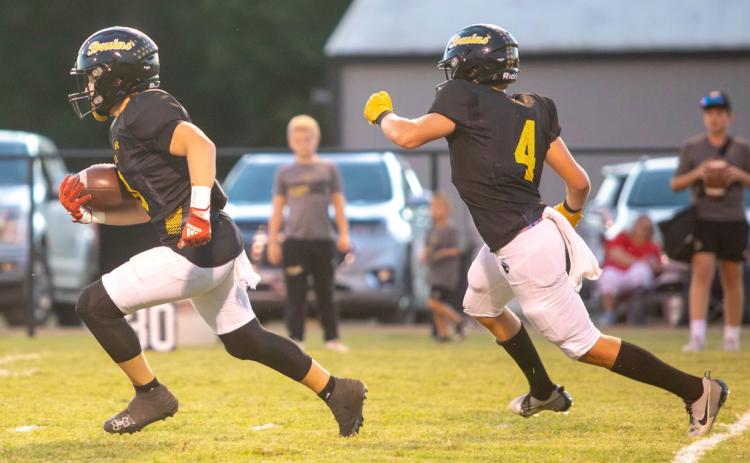 Caddo Bruin Boen Proctor runs with the ball down field followed by Jake Green. Matt Swearengin | Durant Democrat