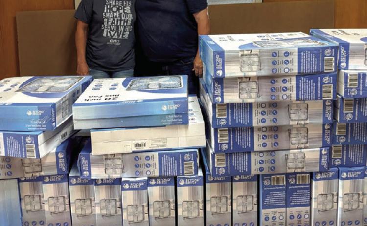OG&E recently partnered with local organizations in the Durant area, including Bryan County United Way and Our Neighbors Cupboard Food Pantry, to donate electric fans to residents and help them beat the summer heat. Robert Holliday (right), community aairs manager at OG&amp;E, delivers 55 fans to Amber Wooley (left), director at Our Neighbors Cupboard Food Pantry. Photo provided