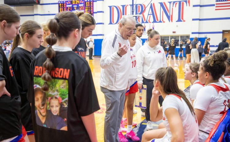 Durant Lady Lions head coach Tony Robinson talks to players during a timeout in the Feb. 13 home game with Tahlequah. The Robinson Family Gym was dedicated after the game. Matt Swearengin | Durant Democrat