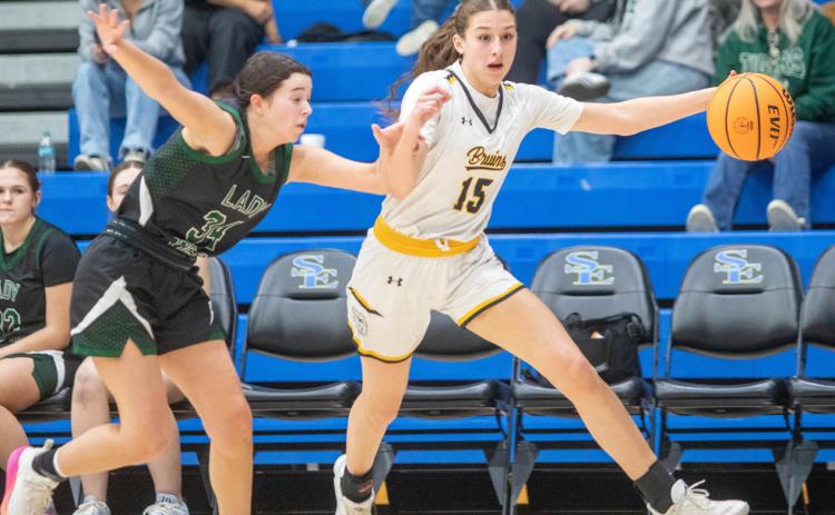 Caddo Lady Bruin Belle Hookom dribbles the ball during the Bryan County Basketball Tournament championship game with Tushka. Matt Swearengin | Durant Democrat