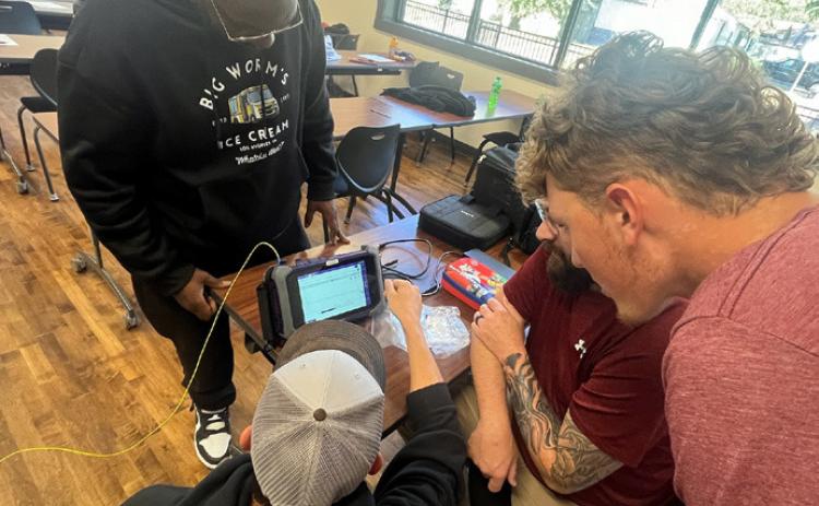 KTC students get hands-on fiber optic training with collaborative group projects that simulate real-world scenarios. Photo provided