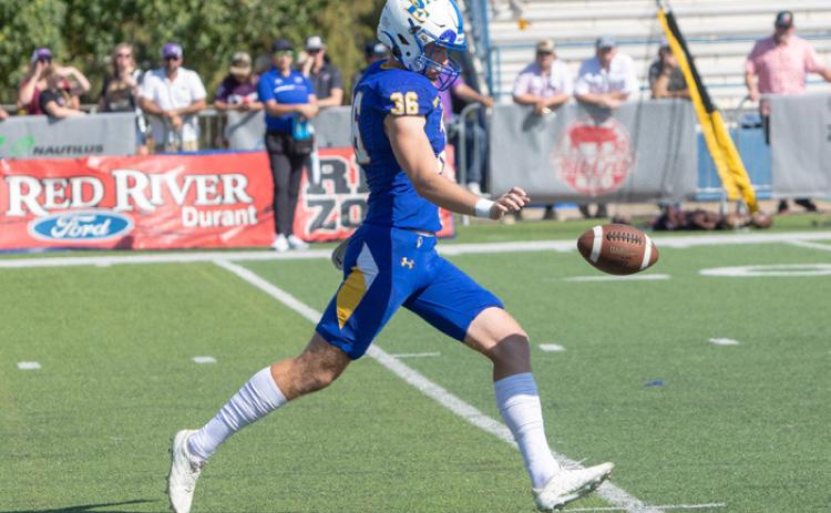Savage Storm football player Jackson Nalley punts the ball. Matt Swearengin | Durant Democrat