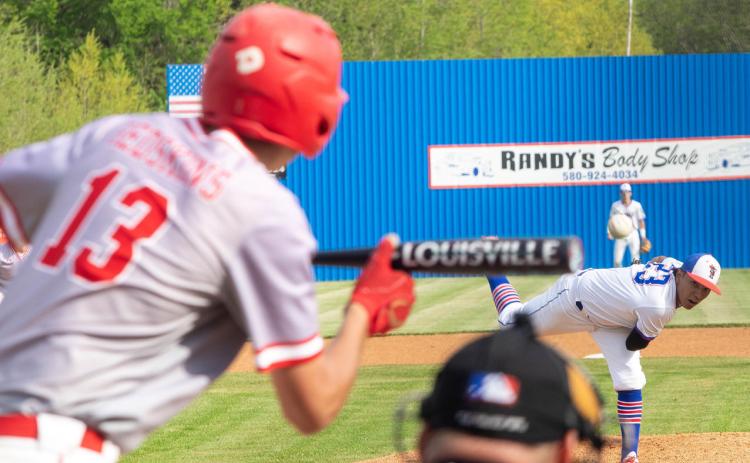 ABOVE: Silo Rebel Gabe Hernandez fires the ball at Kingston Redskin Hayden Seeney. LEFT: Silo Rebel Sam Mendenall swings at the ball. Matt Swearengin | Durant Democrat