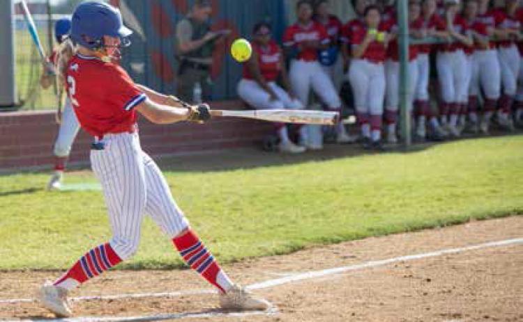 Durant Lady Lion Harper Plymale swings at the ball in the season opener with Ardmore. Matt Swearengin | Durant Democrat