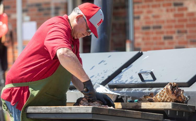 Ronald Jackson prepares barbecue at Kingston Spring Fest. Matt Swearengin | Durant Democrat