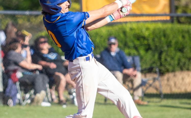 Rock Creek Mustang Kelton Teal hits the ball during a recent game at Calera. Matt Swearengin | Durant Democrat