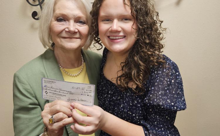 Priscilla Washington, President of Chapter DJ of the P.E.O. Sisterhood presents a $500 check to Laura Swearengin, a 2025 honor graduate of Durant High School. The local scholarship is awarded to Laura as she plans to attend Oklahoma City University this fall as a Choral Music Education major. P.E.O. is a Philanthropic Educational Organization whose goal is to further education for women through grants,, scholarships, awards and loans. Laura is the daughter of Matt and Jennifer Swearengin. Photo provided