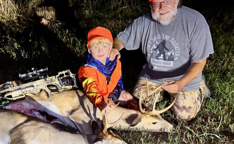 Ben Smith is shown with his grandfather Mark Swearengin after a successful deer hunt last season when Ben harvested his first deer with a crossbow. Photo provided
