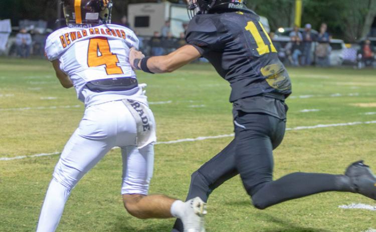 Caddo Bruin Bladyn Brown tries to intercept a pass for Dewar Dragon JoJo Waters. Matt Swearengin | Durant Democrat
