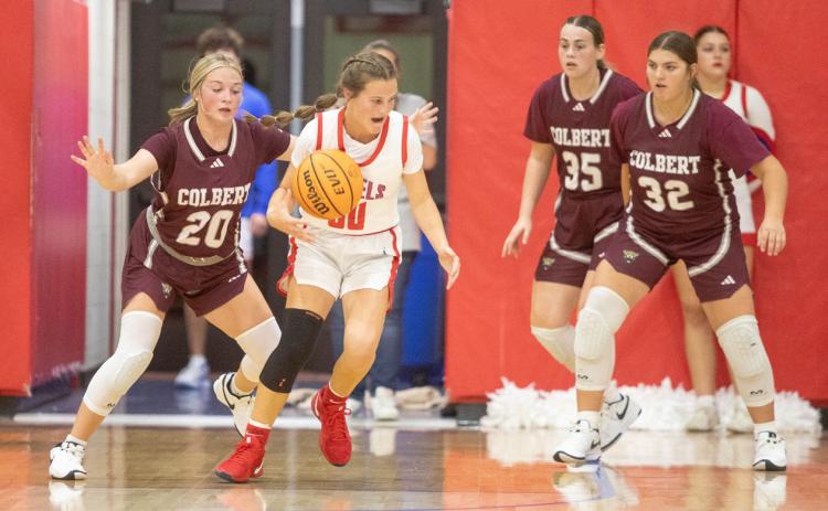 Silo Lady Rebel Kamrey Hendricks moves down court during a November game with Colbert and also shown is Colbert Lady Leopard Dayla Coker. Matt Swearengin | Durant Democrat