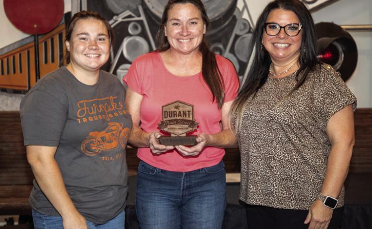 Two of a Kind Thrift store on Main Street in downtown Durant received the Best Window Display award for their display during the recent rodeo parade. The award was presented at last week’s Durant Main Street annual members meeting at Three Valley Museum. From left, Sierra Dillon and her mother Amanda Forsberg of Two of a Kind Thrift, and Melisse Prentice, outgoing Durant Main Street president. Matt Swearengin | Durant Democrat