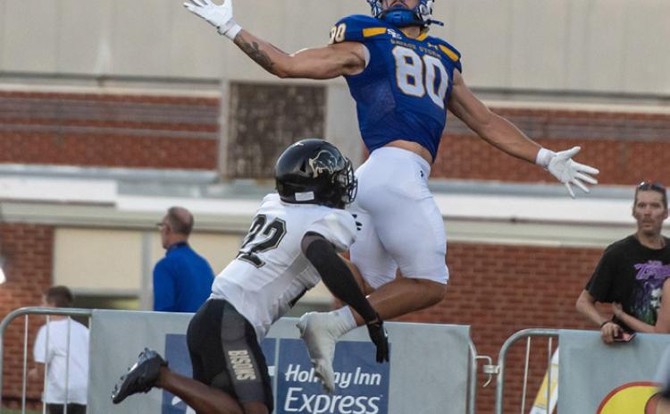 SE football player Matthew Nunez lunges for the ball in the game with Harding. Dan Hoke | SE