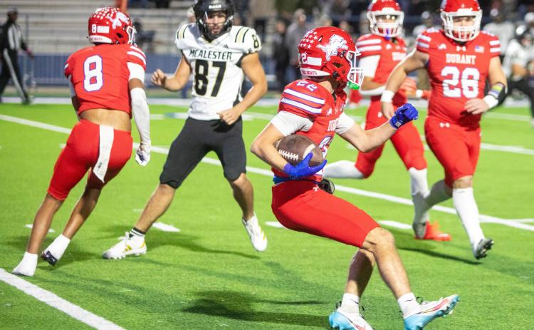 Durant Lion Shajen Davis runs with the ball during last Friday’s home game with McAlester. Other Lions shown include Holdan Robinson and Jaxon Cuesta. Matt Swearengin | Durant Democrat
