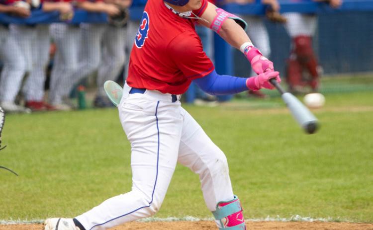 Lion Cole Robbins is about to hit the ball in the game with Madill. Matt Swearengin | Durant Democrat
