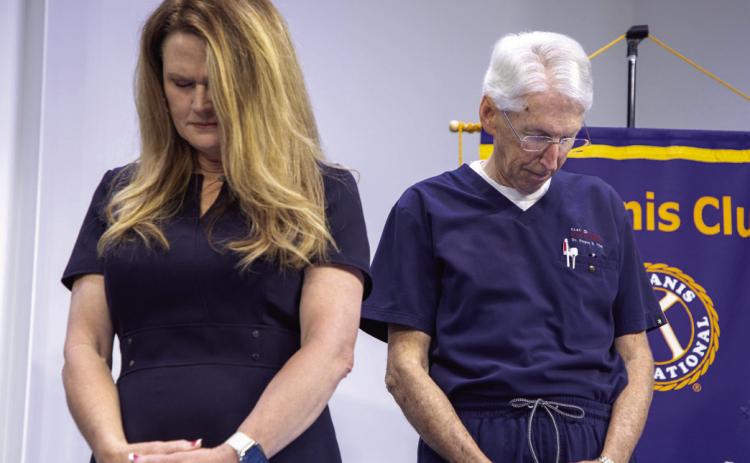 Kiwanis President Shyla Whitlock and Kiwanian Dr. Greg Clay pray during the Kiwanis Club of Durant Prayer Breakfast. Matt Swearengin | Durant Democrat