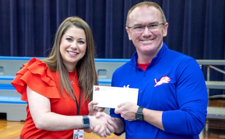 Northwest Heights Elementary School teacher Kasey Bennett is a finalist for Oklahoma Teacher of the Year, and she was the Durant School District’s Teacher of the Year for the 2024-2025 school year. She is shown on Jan. 31, 2025, with Superintendent Mark Moring when she was named the Durant TOY. Matt Swearengin | Durant Democrat
