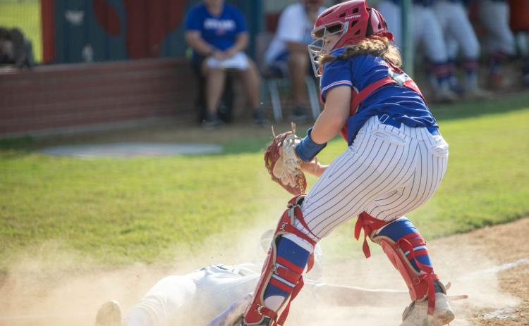 Durant Lady Lions catcher Ryan Uber is shown as an Antlers Lady Bearcat slides into home plate. Matt Swearengin | Durant Democrat