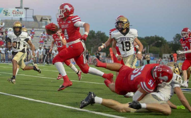 Durant Lion Cale Worsham runs down field while being pursued by Broken Bow players. Matt Swearengin | Durant Democrat