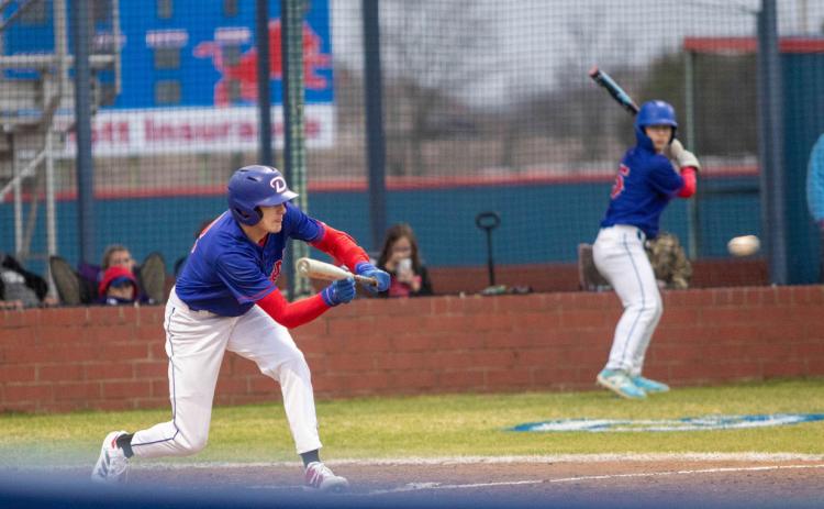 Durant Lion Ryder Jones is about to bunt the ball. Matt Swearengin | Durant Democrat