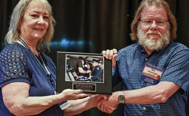 Durant Democrat editor Matt Swearengin received the Weekly Photo of the Year award sponsored by OGE Energy Corp. and Oklahoma Press Association The award was presented by OPA President Suzie Campbell during the Oklahoma Press Association convention in Norman. Photo provided | Oklahoma Press Association