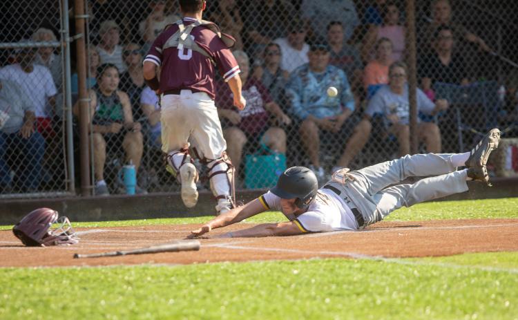 Calera baseball player Talon Rose slides into home plate during the game at Colbert. Matt Swearengin | Durant Democrat