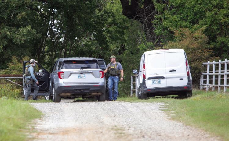 Agents with the Federal Bureau of Investigation and the Bureau of Alcohol, Tobacco, Firearms and Explosives searched a Berrywood Lane home in the Silo area near Durant on Sept. 24 that authorities said was connected to the shooting at an ICE facility in Dallas. The Bryan County Sheriff ’s Offi ce assisted in the search. Matt Swearengin | Durant Democrat