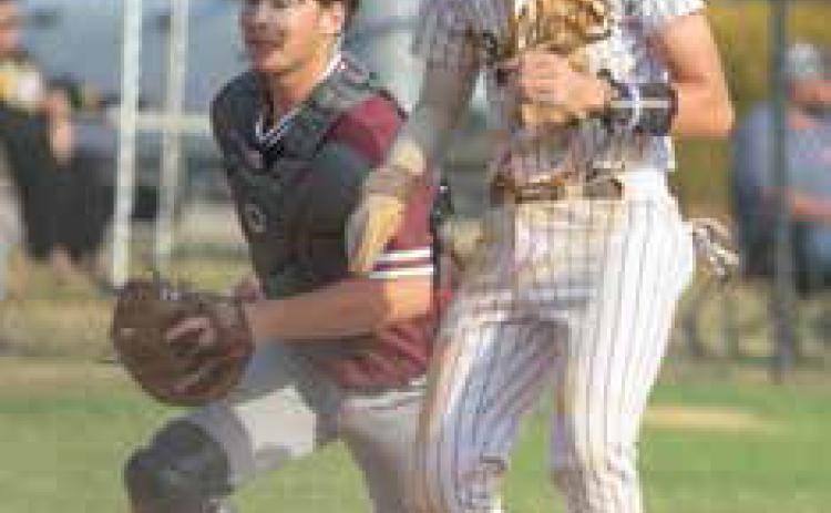 Calera Bulldog Demarcus Dunn makes it to home plate during a recent game and also shown is Colbert catcher Kevin Davis. Matt Swearengin | Durant Democrat
