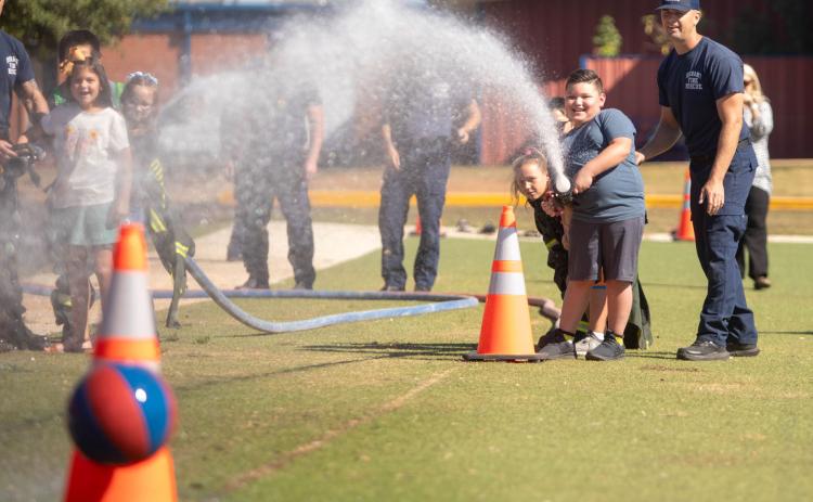 Northwest Heights third-grade students were able to use a fire hose when the Durant Fire Department visited the school last week to educate the students about 9/11 and allow them to handle fire department equipment. The fire department also visited George Washington and Washington Irving elementary schools. Matt Swearengin | Durant Democrat