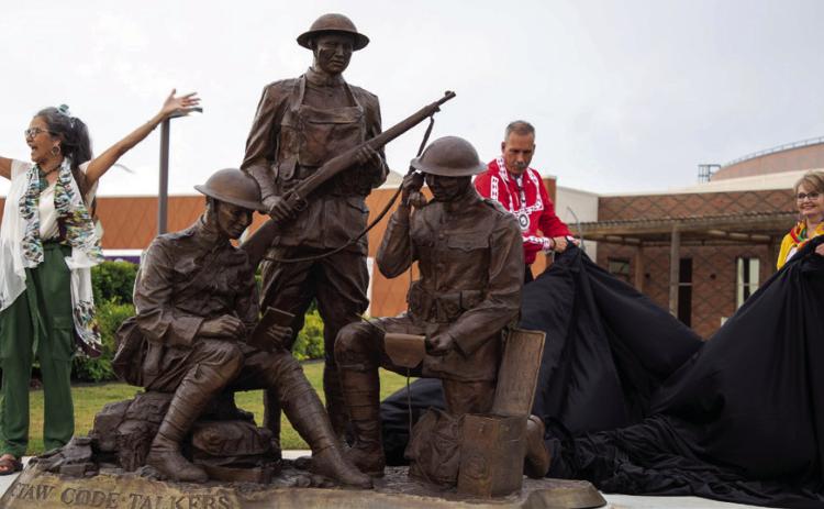 The World War II Choctaw Code Talkers sculpture was unveiled May 22 at the Choctaw Cultural Center. From left, Nuchi Nashoba, president of the Choctaw Code Talkers Association, Choctaw Assistant Chief Jack Austin Jr., artist Jane Semple Umsted and Choctaw Chief Gary Batton. This is the sixth sculpture that Umsted has made for the tribe. Matt Swearengin | Durant Democrat