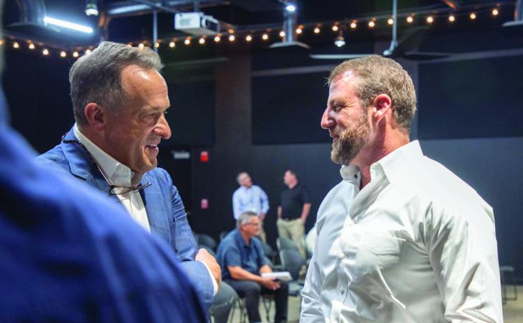U.S. Senator Markwayne Mullin, left, talks to Greg Massey, CEO of First United Bank, during a town hall meeting about state, federal and tribal partnerships last week at the Donald W. Reynolds Community Center &amp; Library. Matt Swearengin | Durant Democrat