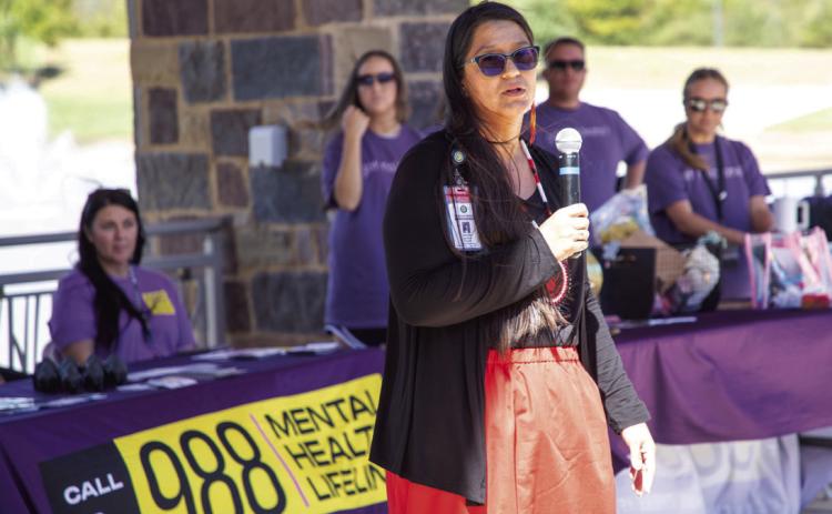 Jennifer Spainhour speaks about her recovery from addiction during a recent recovery walk at the Choctaw Nation pavilion that was hosted by the The Choctaw Nation Health Services Authority. Matt Swearengin | Durant Democrat