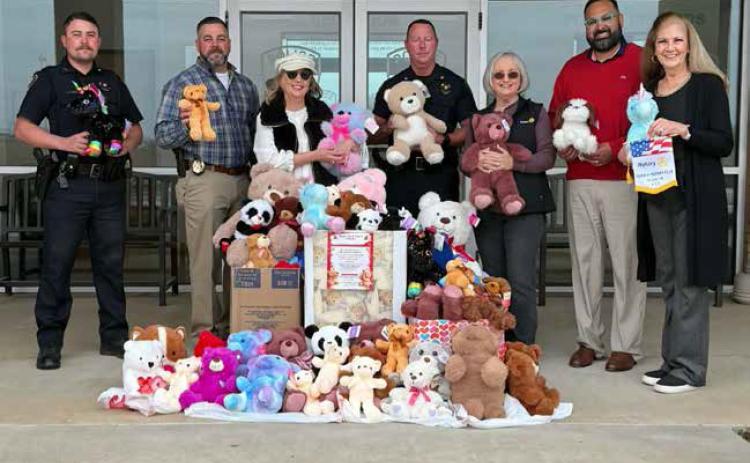 The Durant Rotary Club recently collected Teddy Bears that were donated to the Durant Police Department to give to children. From left, Officer Walker Weger, Sgt. Nick Spencer, Sheri Hutchins, Chief Jessy Petty, Patty Swink, Mike Delloro and Crystal Tatum. Photo provided