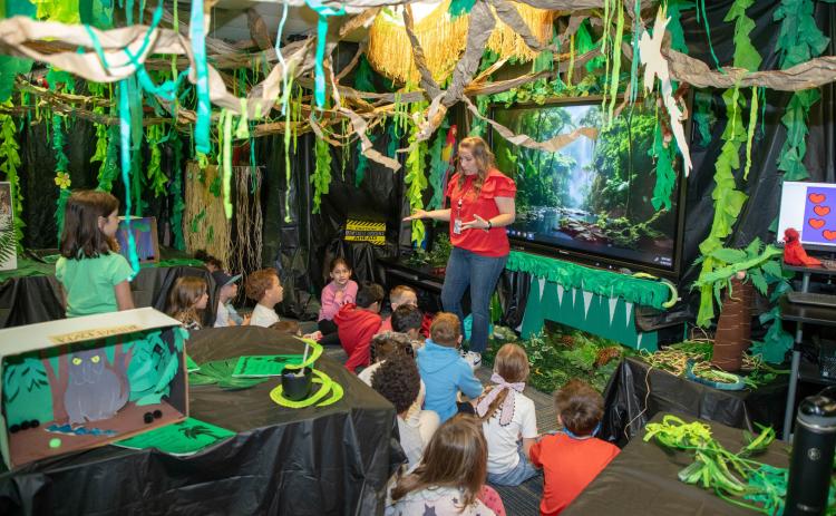 Northwest Heights first grade teachers did an animal research project and all of their rooms were transformed into different environments. Each student wrote a report and created a visual representation of an animal from each classroom’s focused habitat. Shara Davis’s classroom depicts a rain forest. Matt Swearengin | Durant Democrat