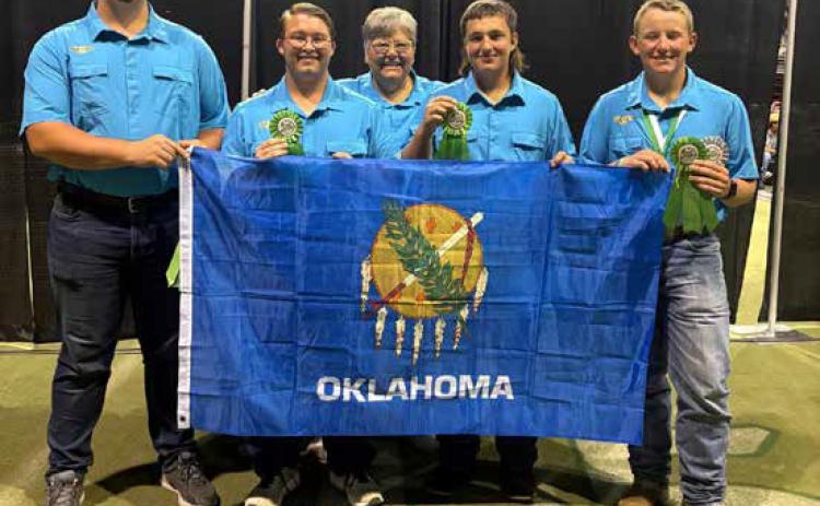 Micheal Murphy, second from right, Bryan County 4, represented Oklahoma at the National 4-H Shooting Sports competition in Recurve Archery. Photo provided