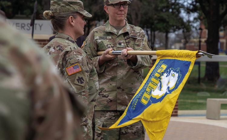 Oklahoma Army National Guard 2nd Battalion 189th Regiment Battalion Commander Lt. Col. Richelle Treece unveils the unit guidon for the Southeastern Guard O_cer Leadership Development (GOLD) program. Matt Swearengin | Durant Democrat