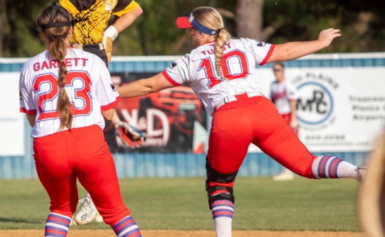 Calera Lady Bulldog Taibree Melton leaps to second base and also shown are Lady Rebels Paetyn Garrett and Kostina Tubby. Matt Swearengin | Durant Democrat