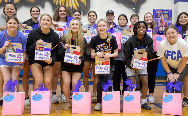 The Durant Lady Lions basketball team poses before the Sunday afternoon sendoff to a state tournament. Matt Swearengin | Durant Democrat